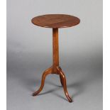 A Victorian circular fruitwood wine table raised on an octagonal column and tripod base 65cm h x