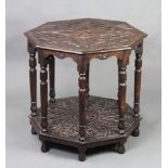 A Victorian carved oak octagonal occasional table raised on turned supports 73cm h x 75cm w x 75cm d