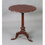 A 19th/20th Century circular Chippendale style mahogany wine table with shaped top, raised on a