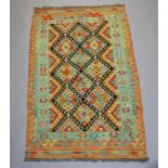 A yellow and green ground Chobi Kilim with all over geometric designs 170cm x 106cm