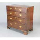 An 18th Century oak chest of 4 long drawers with replacement brass swan neck drop handles, raised on