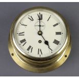 A ward room style clock with 15cm circular painted dial, enamelled numerals, subsidiary second hand,