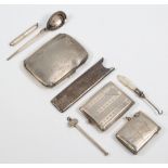 A silver engraved cigarette case Birmingham 1936, a comb case, vesta, match sleeve, spoon and