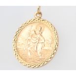 A 9ct yellow gold circular St Christopher pendant 5.7 grams