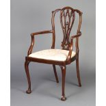 An Edwardian Chippendale style mahogany dining chair with pierced vase shaped slat back and