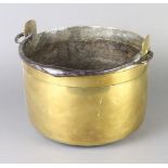 A 19th Century brass preserving pan with steel swing handle 18cm x 28cm