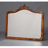 A 1930's Queen Anne style arched plate mirror contained in a walnut frame 56cm x 66cm