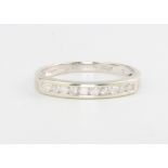 A 9ct white gold diamond half eternity ring, size M, 1.6 grams