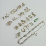 A collection of silver charms 42 grams
