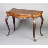 A 19th Century French mahogany card table of serpentine outline raised on carved cabriole supports