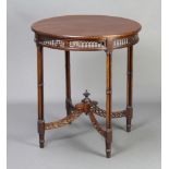 A circular Chippendale style mahogany occasional table with pierced fret and X framed stretcher,