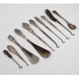 A silver mounted button hook Chester 1913, 4 others, 2 shoe horns and minor items