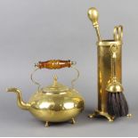 A Victorian circular brass kettle with amber glass handle 18cm x 18cm (some dents) and a brass