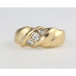 An 18ct yellow gold diamond set ring, size K, 6.4 grams