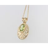 A 9ct yellow gold oval peridot pendant on a ditto 46cm chain, 2.4 grams