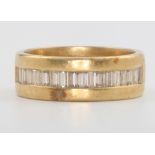 A gentleman's yellow gold baguette cut diamond ring, approx. 0.9ct with 18 stones, 11.5 grams,