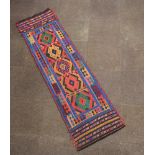A blue, orange and red ground Suzni Kilim runner with 5 panels to the centre 236cm x 66cm