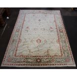 A white, red and green ground Caucasian style carpet 444cm x 291cm Slight discolouration