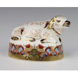 A Royal Crown Derby Imari pattern paperweight or a water buffalo with gold stopper