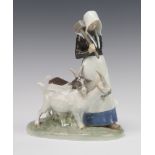 A Royal Copenhagen figure of a lady with goats 694, 23cm