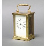 A 19th Century French 8 day carriage timepiece with enamelled dial and Roman numerals, contained