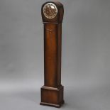 A 1930's longcase clock, the dial with silvered chapter ring and Arabic numerals, contained in a oak
