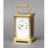 A 19th Century French 8 day carriage timepiece with enamelled dial and Roman numerals contained in a