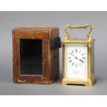 A 19th/20th Century French 8 day striking carriage clock with enamelled dial and Roman numerals
