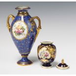 A Royal Crown Derby baluster vase, the blue and gold ground decorated with a panel of spring flowers