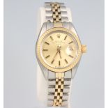 A lady's Rolex Oyster Perpetual date wristwatch on a bimetallic bracelet, the case stamped 5058428