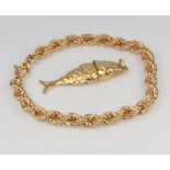 A 9ct yellow gold rope twist bracelet and a ditto articulated fish charm, 11 grams