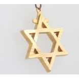 A 9ct yellow gold Star of David pendant, 35mm, 9.5 grams