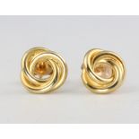 A pair of 9ct yellow gold whorl ear studs 1.5 grams