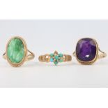 A 9ct yellow gold amethyst ring size P, a 9ct yellow gold jade ring size N and a 9ct yellow gold