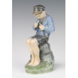 A Royal Copenhagen figure of a boy whittling 905 19cm