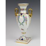 A 20th Century Dresden porcelain 2 handled vase decorated with flowers on a square base 28cm