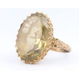 A 9ct yellow gold oval cut quartz dress ring, size S, 12 grams