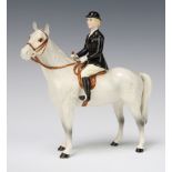 A Beswick figure "Huntswoman" style 2 with rocking horse grey body and black gloss jacket, 21cm,