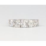 An 18ct white gold 5 stone diamond ring approx. 2.85ct, size N, 3.7 gramsThis ring is modern and