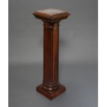 A Victorian bleached and fluted mahogany column with pink veined marble top, dentilled cornice,