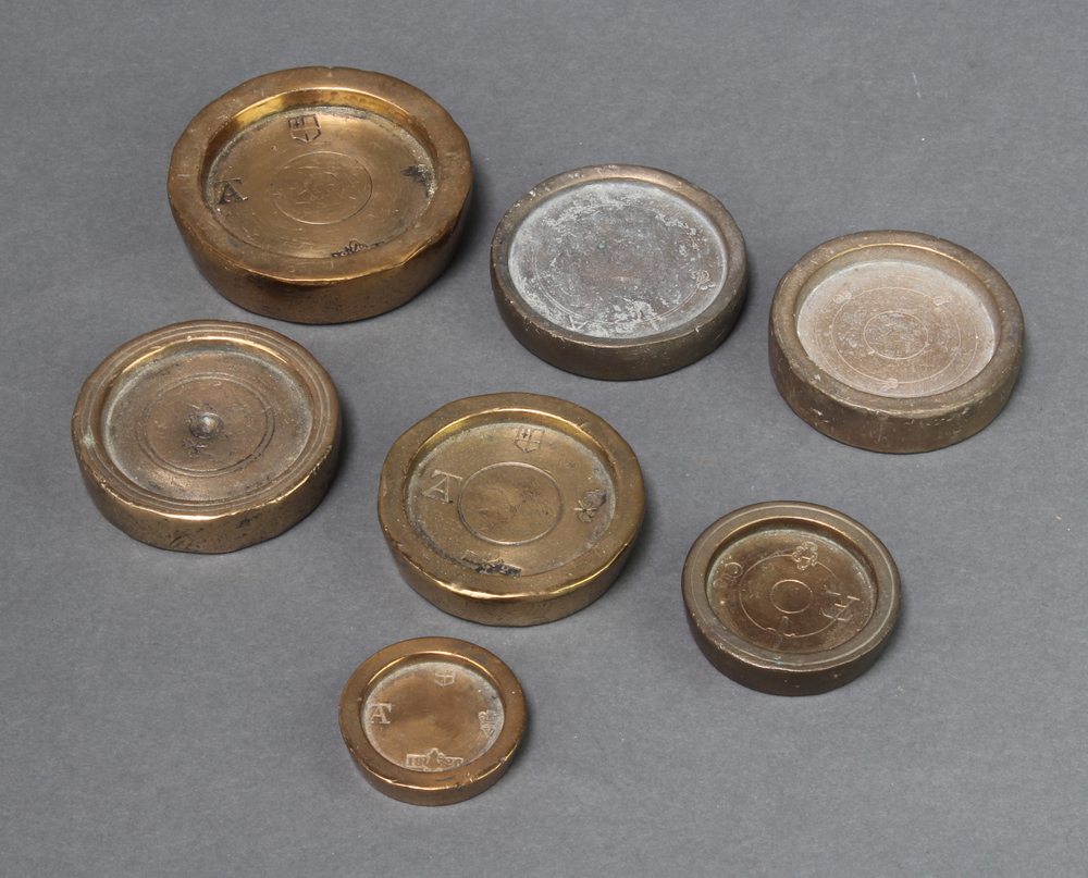 Four 18th Century circular brass weights, 3 marked 1826, all marked AT with City of London crest and