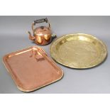 An early copper kettle, an Eastern embossed brass tray 35cm diam. and a rectangular copper and brass