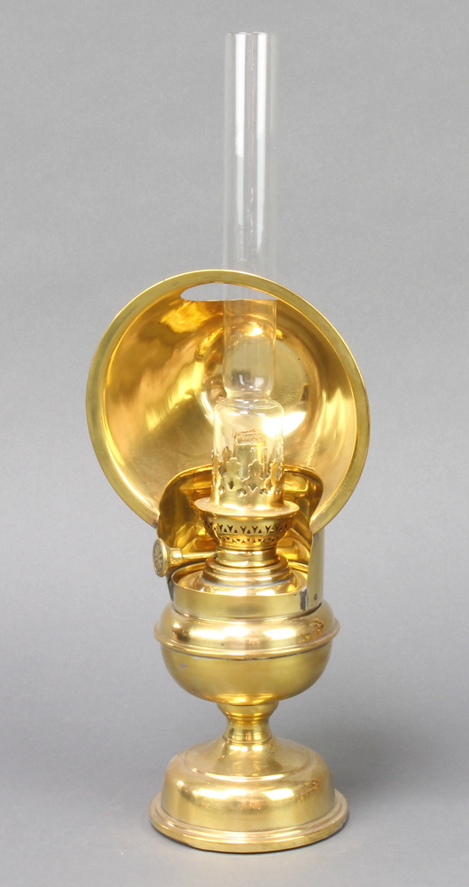 A Victorian brass Queens reading lamp with clear glass chimney 41cm h x 10cm