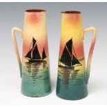 A pair of 1930's Devon Ware jugs decorated with sailing boats 24cm