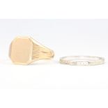 A 9ct yellow gold signet ring 4.6 grams size R and an 18ct white gold wedding band 2 grams size Q