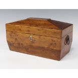 A Georgian yew twin compartment tea caddy of sarcophagus form with ring drop handles, the hinged lid