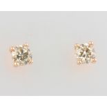 A pair of 18ct rose gold single stone diamond solitaire ear studs approx. 0.48ct, 1 grams
