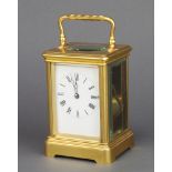 A 20th Century 8 day French quarter repeating carriage clock with enamelled dial and Roman numerals,