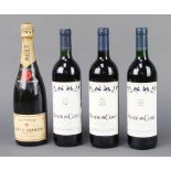 A bottle of Moet & Chandon Champagne together with 3 bottles of 1990, 1998 and 2000 Mouton Cadet