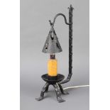 A wrought iron table lamp in the form of a 17th Century style candlestick with shade 40cm h x 18cm w